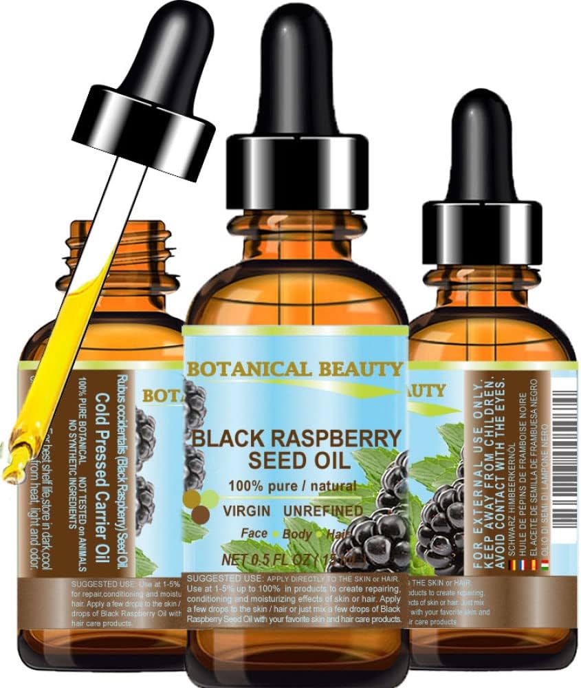 Pestki malin wirują w prasie tłoczącej złocisty olej